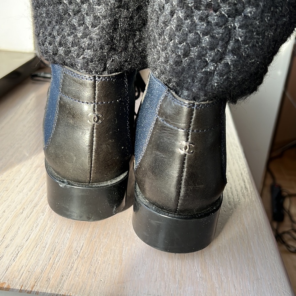 Beautiful Black Chanel Boots with Navy Detail and Silver CC logo on back.